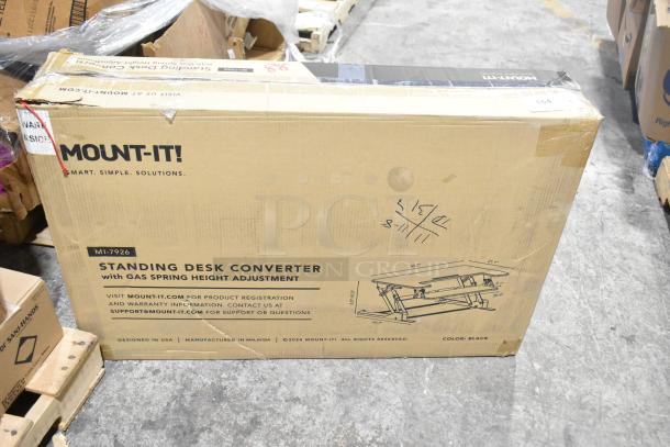 Mount-it MI-7926 Standing Desk Converter in original packaging, features gas spring height adjustment. Condition: New, minor box damage.