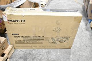 Mount-it MI-7926 Standing Desk Converter in original packaging, features gas spring height adjustment. Condition: New, minor box damage.