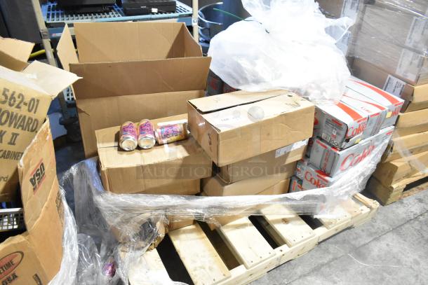 Mixed lot of 30 items including Coca-Cola and Tropicana, displayed in various boxes on a pallet; potential high value.