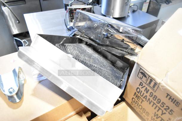 Box containing 75 new scratch and dent items, including Cambro CLJ6190 translucent lids with straw slots, and poly hand soap dispensers.