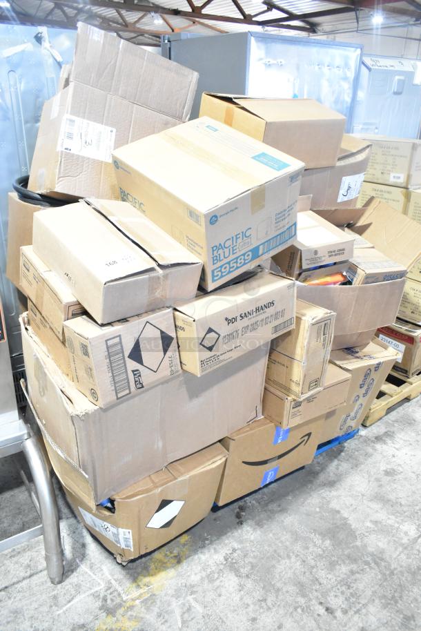 Stack of 24 new items, including Pacific Blue 59589 dispensers. Some boxes marked "scratch and dent," varying contents.