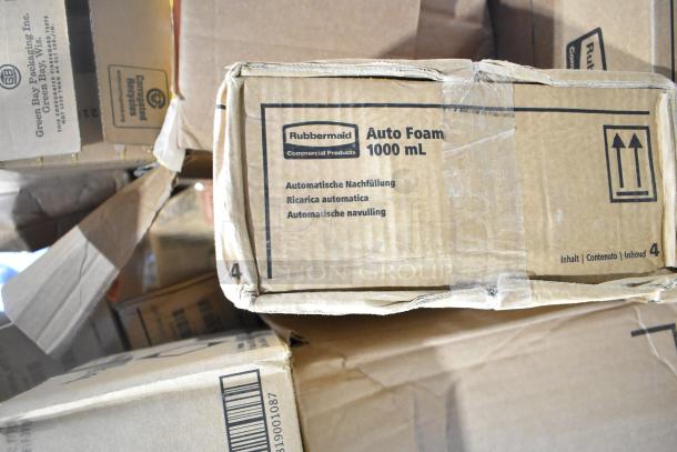 24 boxes of brand new scratch-and-dent items, including Rubbermaid Auto Foam Refills. Boxes show labels and minor wear.