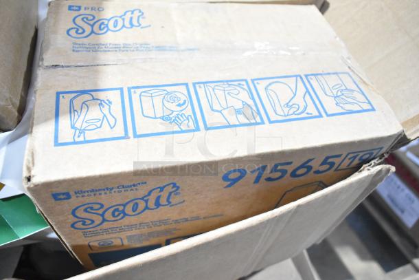Box of Scott Pro products, marked "Kimberly-Clark Professional" with hand installation illustrations, code 91565.
