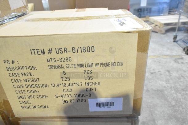 Box labeled "Item # USR-6/1800 MTG-6295" containing 6 Universal Selfie Ring Lights with phone holders; dimensions 13.4x10.43x8.7 inches.