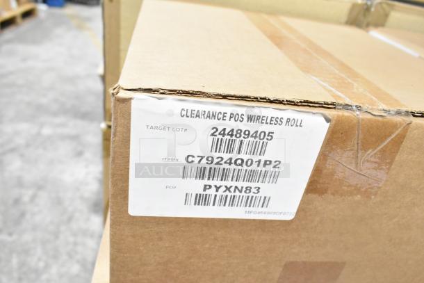 Cardboard box with label showing "Clearance POS Wireless Roll," item number "C7924Q01P2." Box contains assorted scratch and dent items.