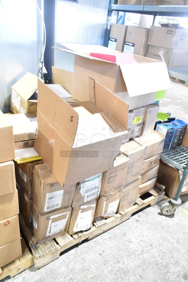 Boxes of brand new scratch and dent items, including Purell 5051-02 Hand Sanitizer and Diversey Crew Rejuvenator, on a pallet.