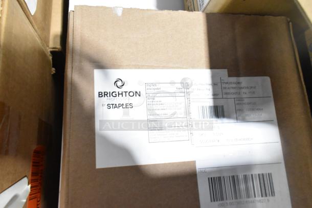 Box containing Brighton Professional by Staples with visible labeling, part of 31 scratch and dent items, including Purell sanitizer.