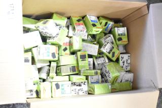 Box of 98 new Trodat ink pads in various colors, including black, blue, green, and red. Some boxes show minor cosmetic imperfections.