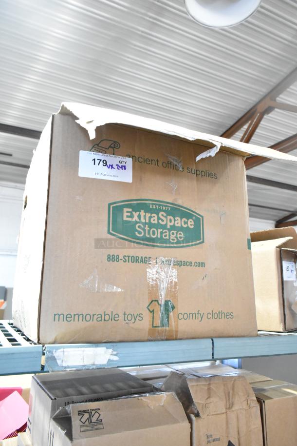Cardboard box labeled "ExtraSpace Storage," contains 248 new scratch and dent items including flush mount grommets, bulbs, and lamps.