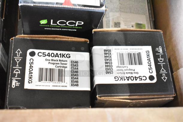 Boxes of LCCP C540A1KG black toner cartridges, brand new in original packaging, part of scratch and dent batch.