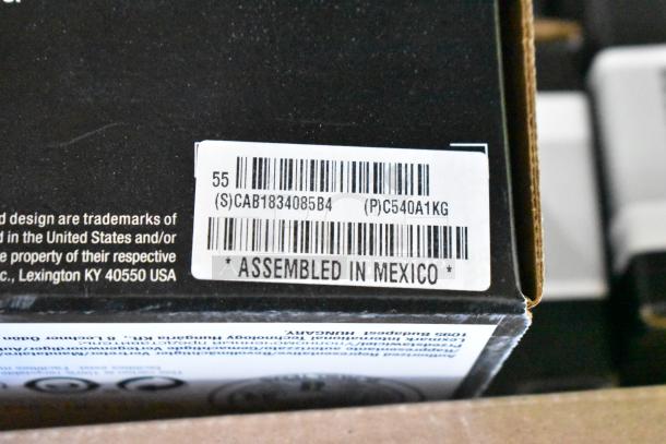 Box with a label indicating "Assembled in Mexico" and product code "C540A1KG," possibly related to LCCP ink items.