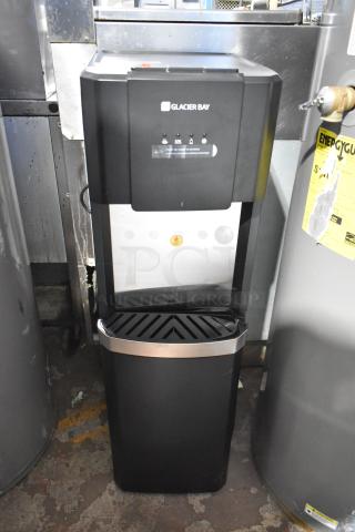 Glacier Bay LY619 water dispenser, matte black and stainless steel, bottom load. 115 volts, 1 phase. Appears in good condition.