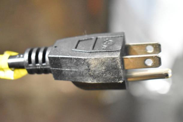 Close-up of a black electrical plug associated with the Glacier Bay LY619 water dispenser.