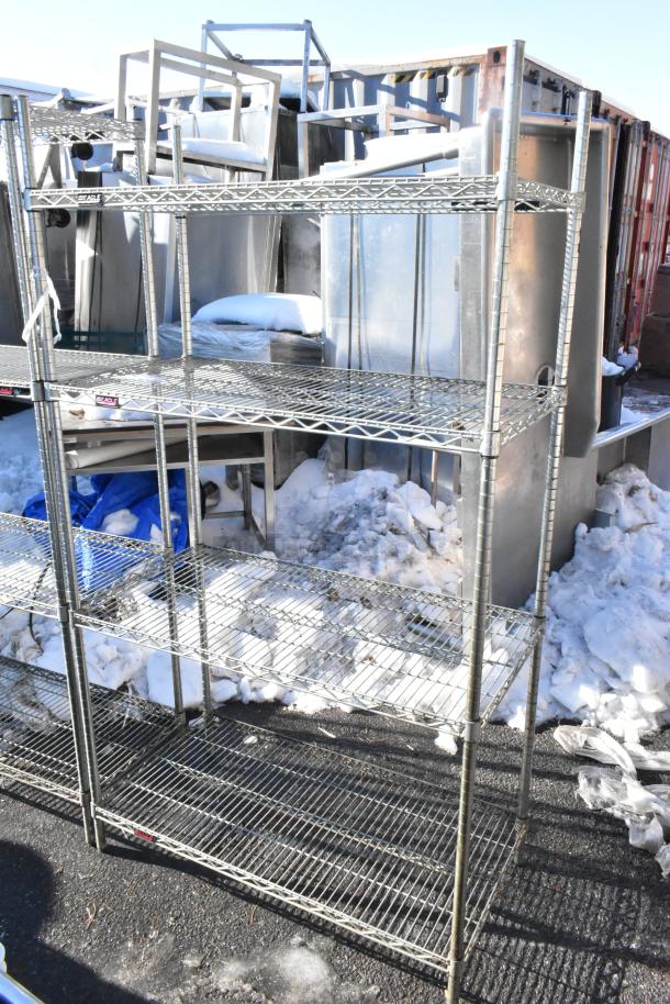 Chrome finish 4-tier wire shelving unit, outdoor setting, dismantling required by buyer, consider freight charges.