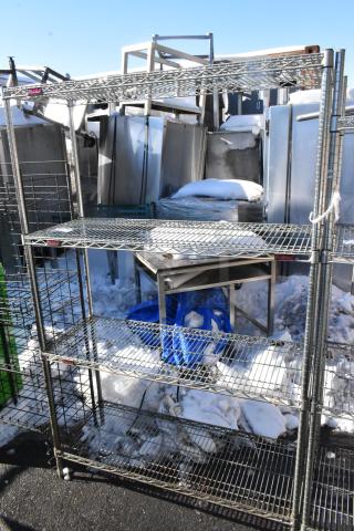 Chrome finish 4-tier wire shelving unit, used condition, sturdy metal, requires dismantling for shipment.