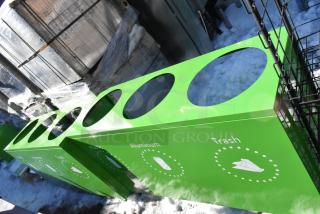 2 green recycling bin shells with 3 labeled trash deposit holes for plastic, aluminum, and trash; new condition.