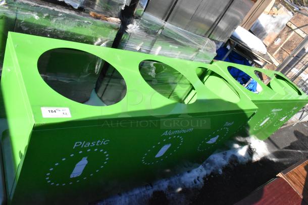 Green recycling bin shell with three deposit holes labeled for plastic, aluminum, and trash. Includes "184 lbs QTY x2" tag.