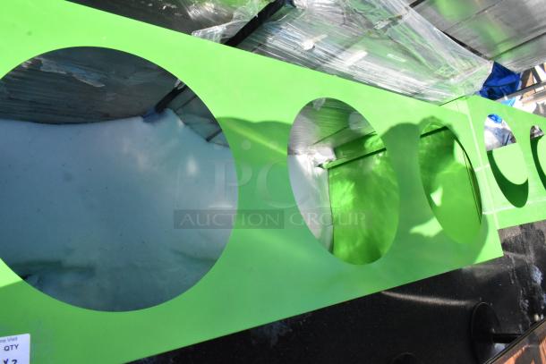 Green recycling bin shell with three trash deposit holes, new condition, includes packaging.