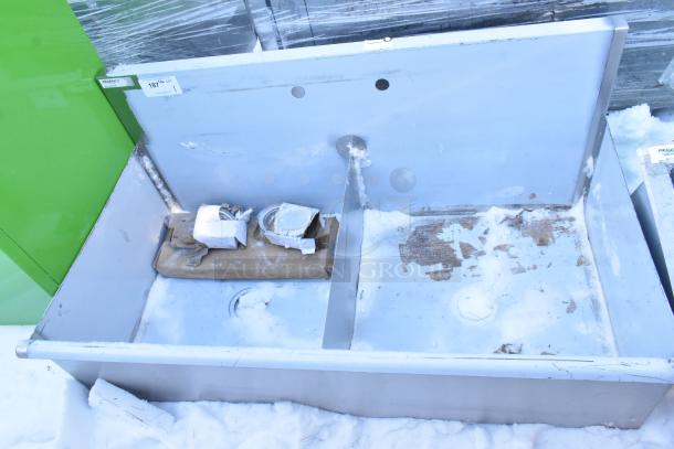 Regency 2 Bay Sink, brand new, showing scratches and dents. Includes attached packaging and labels. Ideal for commercial use.