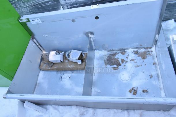 Brand new Regency 2 Bay Sink, scratch and dent condition. Includes drain holes and wrapped components. Label reads "Regency".