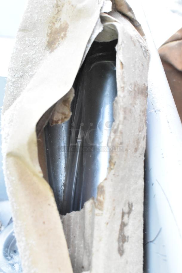 New Regency 2 Bay Sink, partially unwrapped, showing stainless steel surface, in brand new scratch and dent condition.