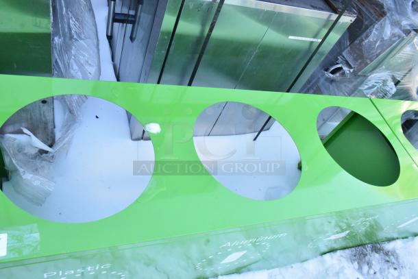 Brand new green recycling bin shell, scratch and dent, with 3 trash deposit holes labeled for plastic, aluminum, and food.