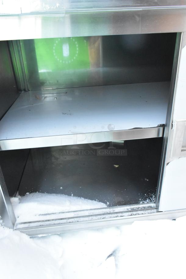 Steelton 522EBTB3048D work table, stainless steel, two doors, under shelf, scratch and dent condition, brand new.