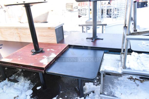 Three dining height tables in varied conditions, featuring metal bases and wooden tops with some visible wear.