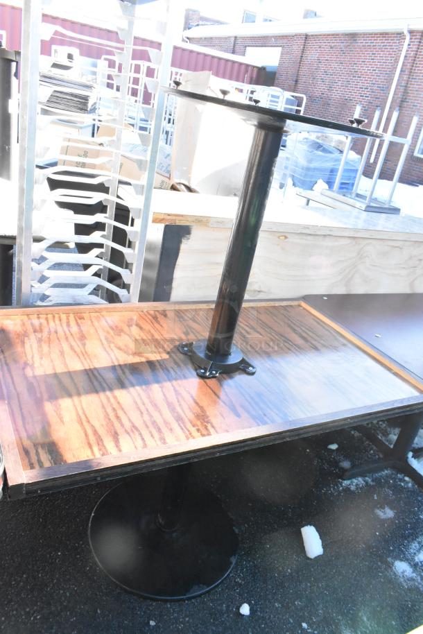 8 various dining height tables with wooden tops and metal bases, used condition. Bid includes all tables.