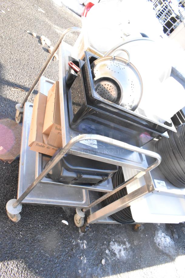 3-tier metal cart on commercial casters, includes colander, poly drop-in bins, cardboard box labeled "Paddle for mixer."
