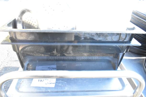 3 tier cart on commercial casters, includes colander and poly drop-in bins, visible label stating "197 QTY 1 w/contents", in good condition.