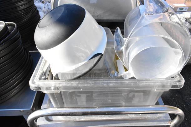 3-tier cart with commercial casters, includes poly drop-in bins, colander, and measuring tools. Used condition.