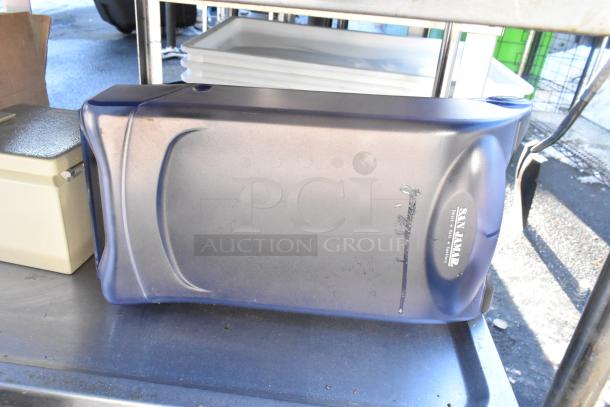 3-tier cart with commercial casters, featuring colander, poly drop-in bins. Visible "San Jamar" label. Good condition.