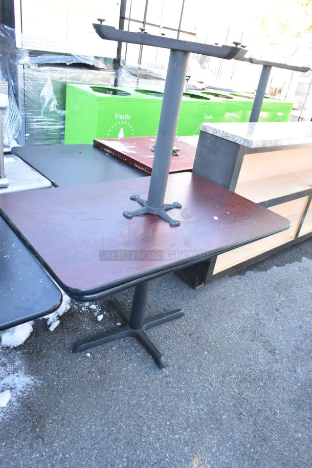 Six dining height tables on auction, featuring varied finishes and sturdy bases, ideal for restaurant use. Mixed condition.
