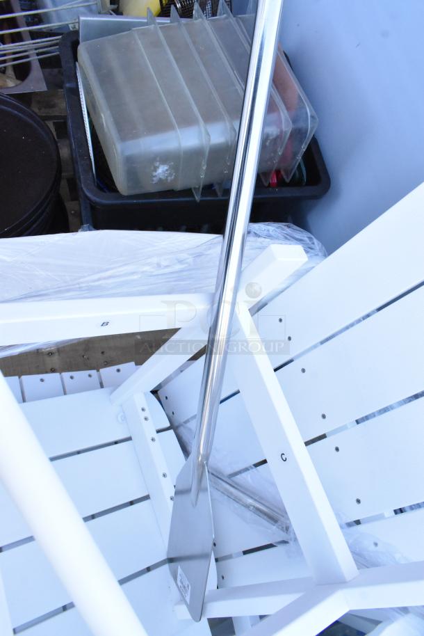 Six assorted items including white chairs and mixing paddles; condition appears new with some packaging visible.