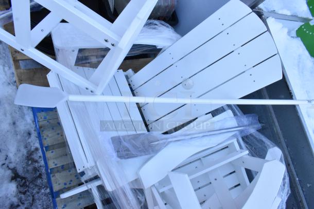 White wooden chairs, an end table, and mixing paddles, wrapped for auction. Items are in new condition.