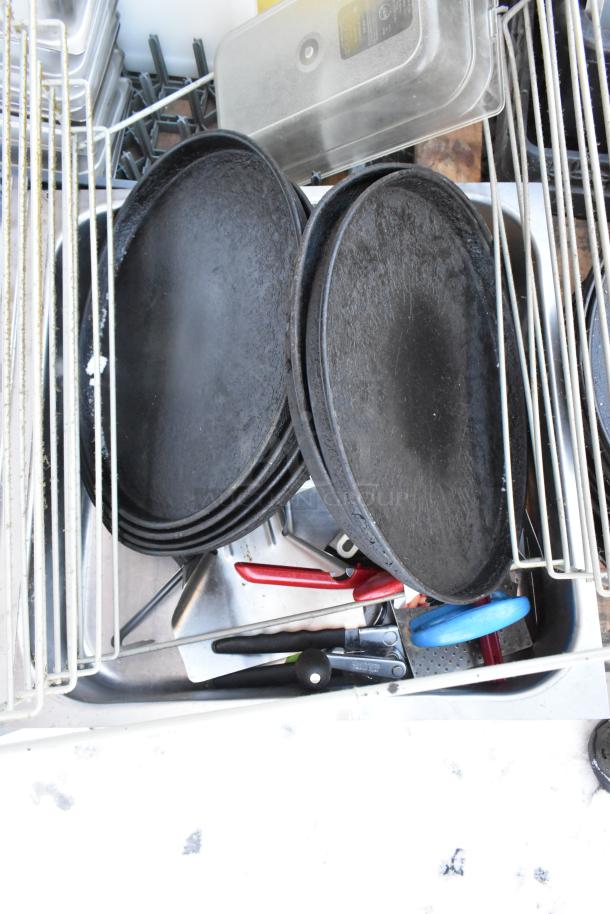 Pallet lot with serving trays, poly drop-in bins, and a fry basket, in used condition.