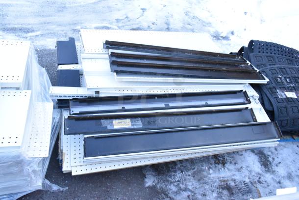 Pallet lot of various items including metal shelves; mixed colors, condition looks fair, visible labels indicate size and type.