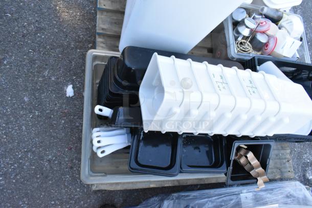 Pallet lot of kitchen items including ingredient bin, poly bins, serving spoons, and spatulas, in good condition.