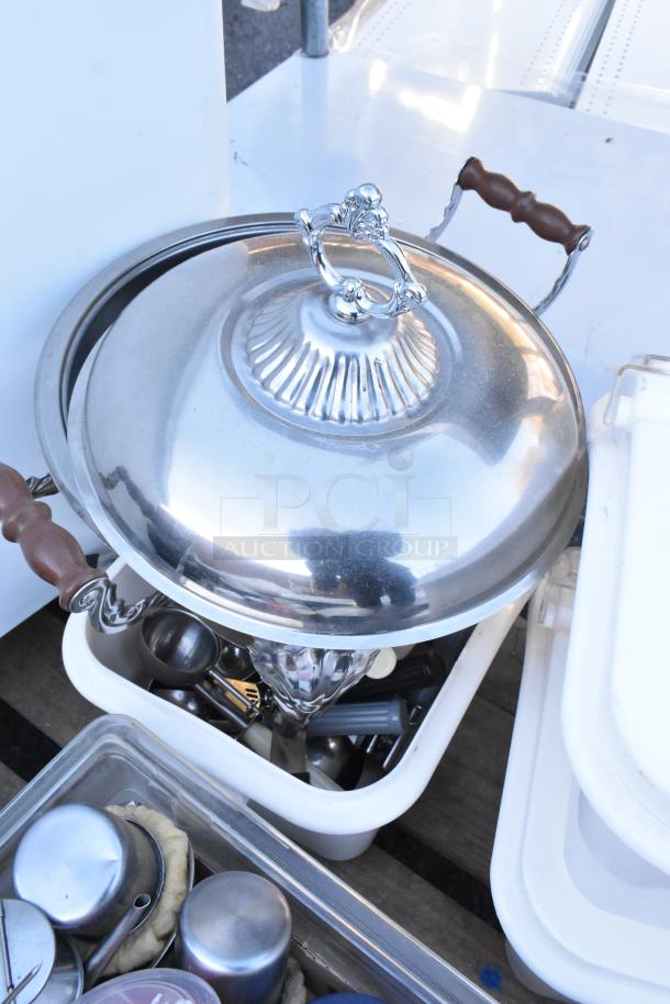 Pallet lot of various items including stainless steel chafing dish with wooden handles, ingredient and poly bins, kitchen utensils.