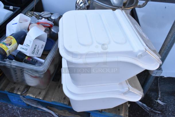 Pallet lot of various items including white ingredient bins, poly bins, spices, serving spoons, and spatulas.