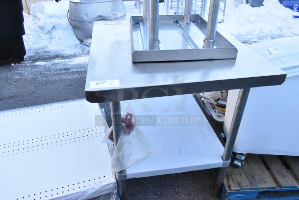 Two Regency tables with under shelves, including model 600T1824G, in good condition. Tables feature stainless steel tops and sturdy construction.