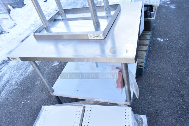 Two Regency tables with under shelves, including model 600T1824G, in stainless steel, commercial use, good condition.