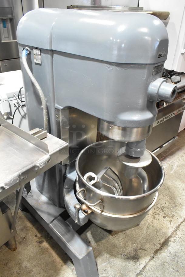 Hobart H 600T 60-quart commercial dough mixer with mixing bowl, dough hook, and paddle. 200V, 3 phase. Good condition.