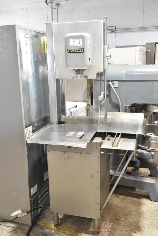 Hobart 5614 commercial meat saw, floor style, 200-230V, 3 phase. Stainless steel, used condition, visible Hobart label.