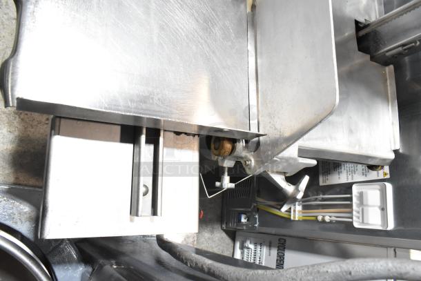 Hobart 5614 commercial meat saw, stainless steel, floor style, visible wiring, 200-230V, 3-phase, model tag attached.