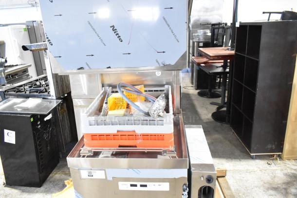 Brand new Noble 495NODTVL1 ventless high-temperature door-type dishwasher, 2024 model, showing protective packaging.