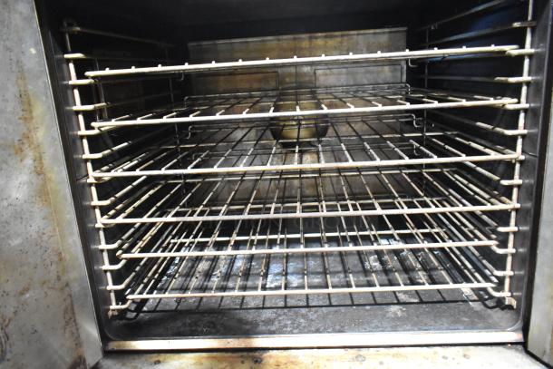 Garland Master 200 convection oven interior with metal racks, view-through doors, thermostatic controls; well-used condition.