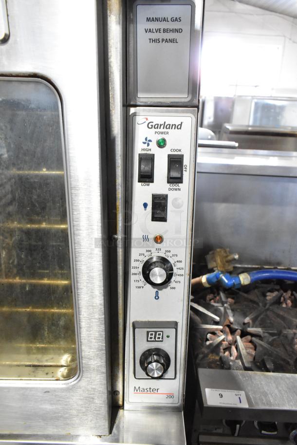 Garland Master 200 commercial convection oven with view-through doors, metal racks, and thermostatic controls.