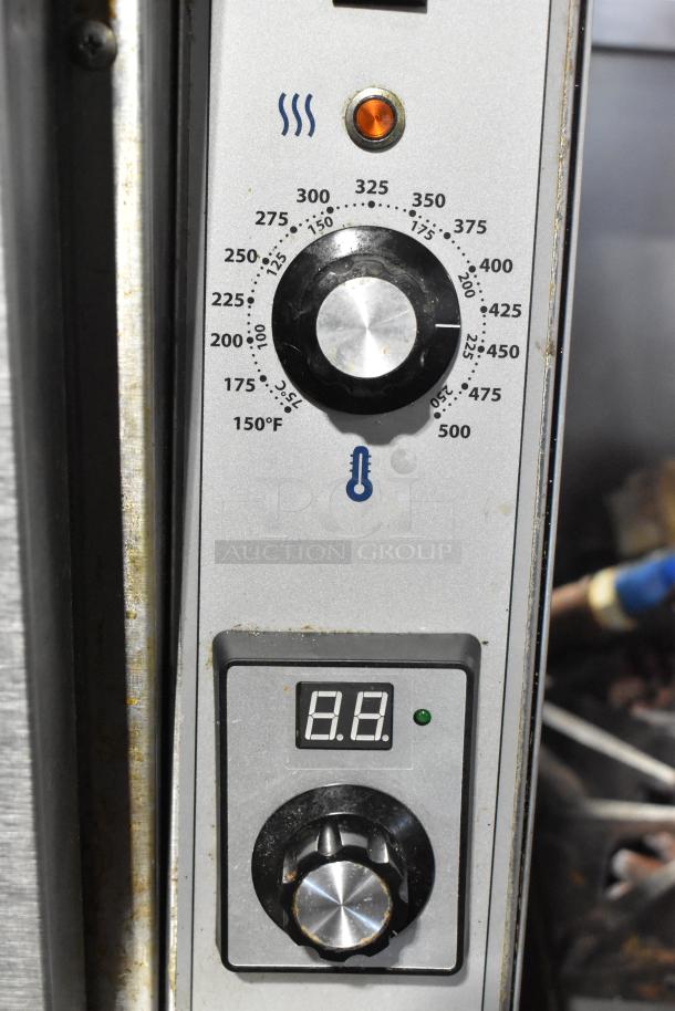 Garland Master 200 convection oven controls with temperature dial. Includes digital display and thermostatic settings.